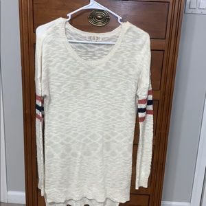 White sweater with striped sleeves